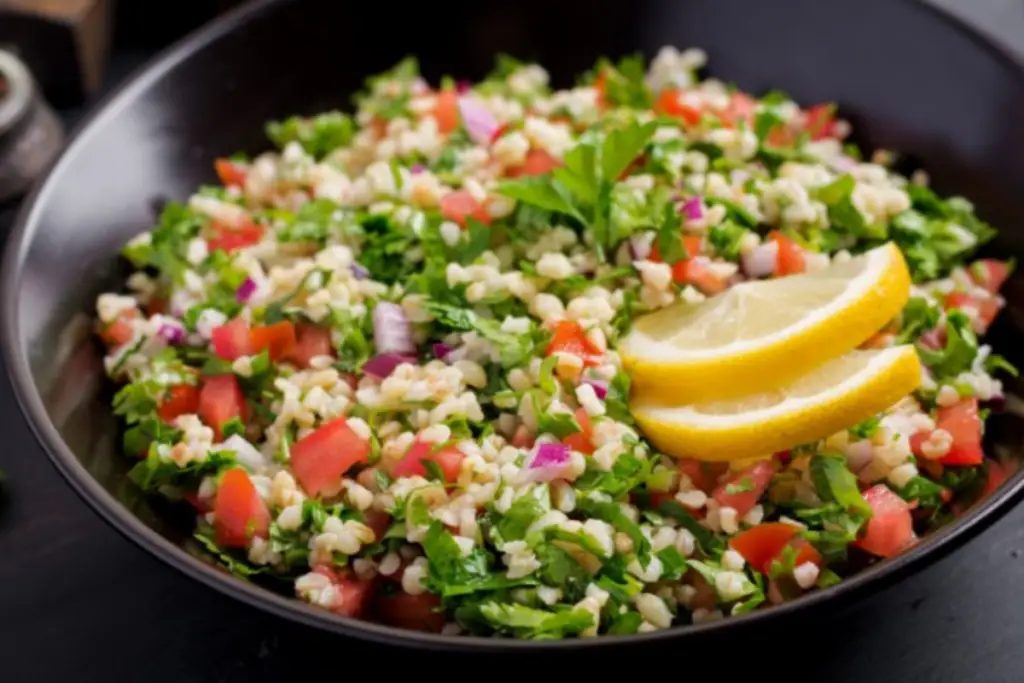 Couscous Salad - A Vibrant Culinary Masterpiece with Fresh Vegetables, Herbs, and Quality Olive Oil